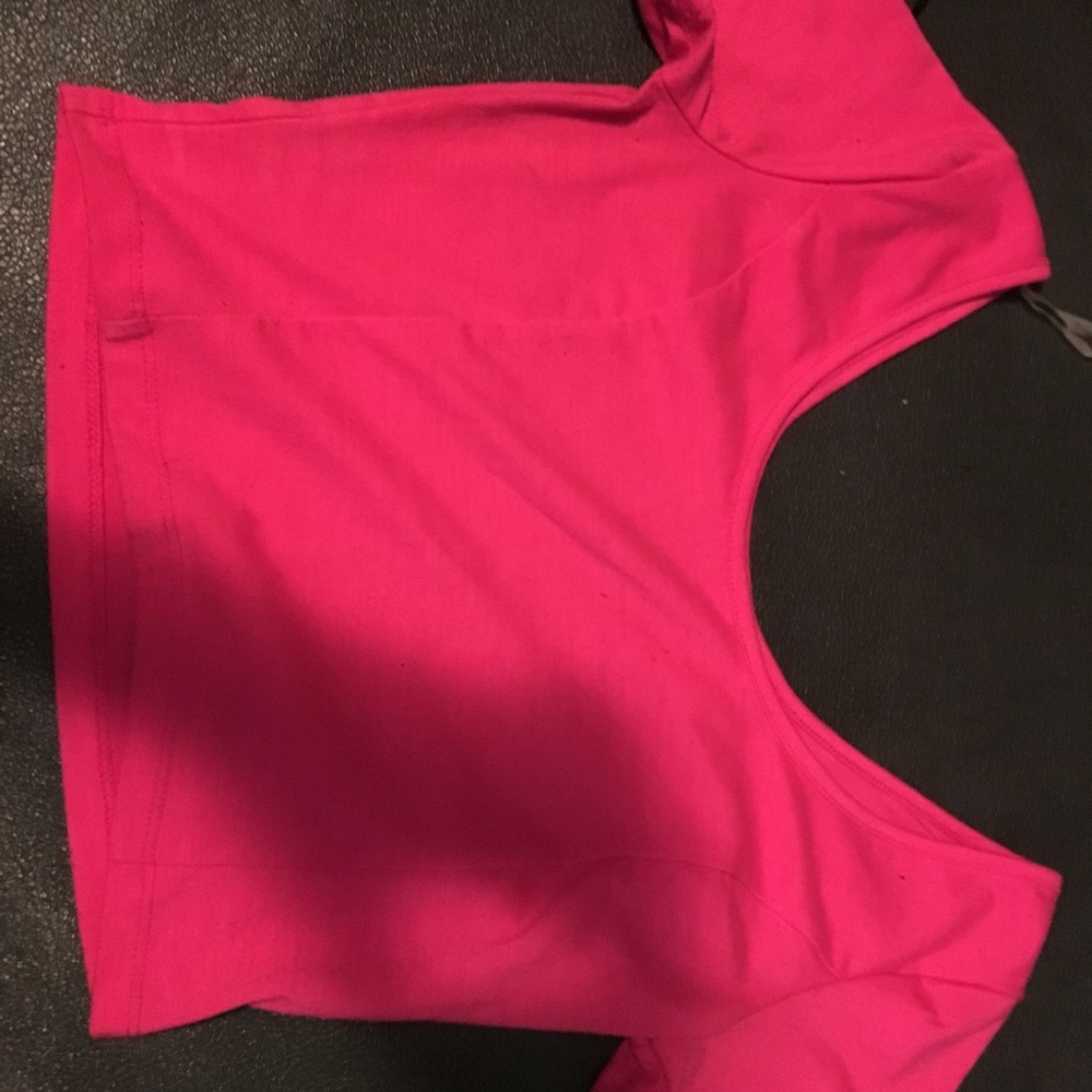 A pink off the shoulders crop top